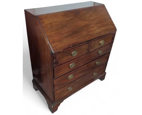 A 19th century mahogany bureau with fall front above two short and three long drawers, with decorative brass swing handles an