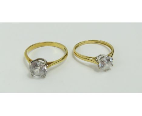 A single stone CZ ring with a four claw setting, finger size Q, marked '18ct', together with another similar, finger size P, 