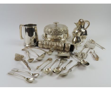 A small silver cream jug, of baluster form, a Georgian silver mustard spoon, six matching silver napkin rings and a silver Ge