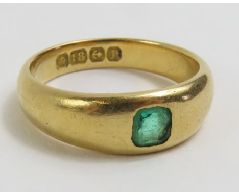 An 18ct gold gypsy style ring, set with a single square shaped emerald, finger size I1/2, 4.4g gross