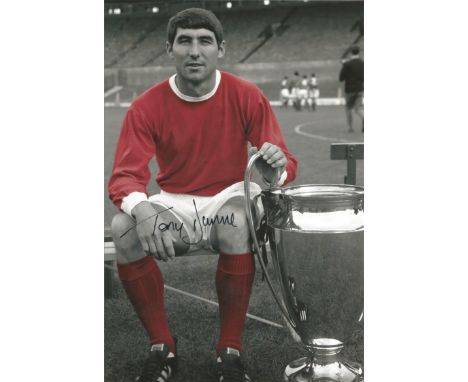 Autographed 12 X 8 Photo, Tony Dunne, A Superb Image Depicting Dunne Posing With The European Cup During A Photo-Shoot At Old