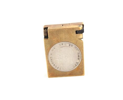 A Heavy Brass Lighter, having inset George V Halfcrown and stamped to base DGM Product. c.1920's
