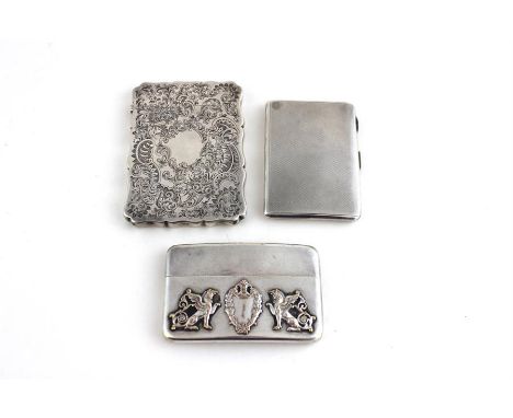 A&nbsp;white metal visiting card case, of curved rectangular form, having applied central acanthus leaf shield cartouche to c