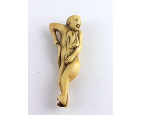 A Japanese&nbsp;Edo period ivory netsuke of gentleman bather toweling himself, 18th century, carved ivory, signed. Length 7.5