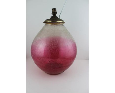 Large pink bulbous crackle glass lamp base. 40cms high. The base has been riveted.