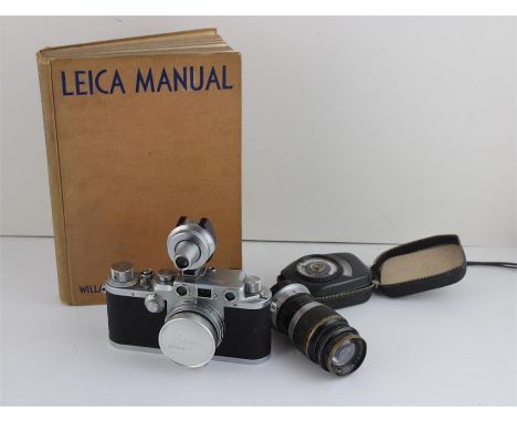 An original leather cased Leica DRP Ernst Leitz camera summitar f=5cm lens, light meter, and a German Leitz Elmar cased lens 