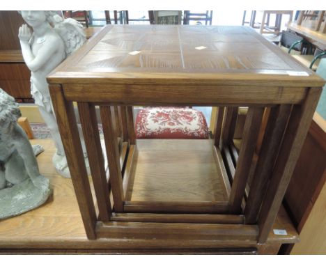 A vintage oak nest of table, parquet style top