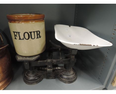 A vintage cast scale set and salt glazed flour jar