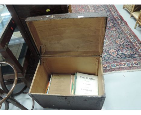 A traditional trunk, of small proportions, containing vintage sheet music etc