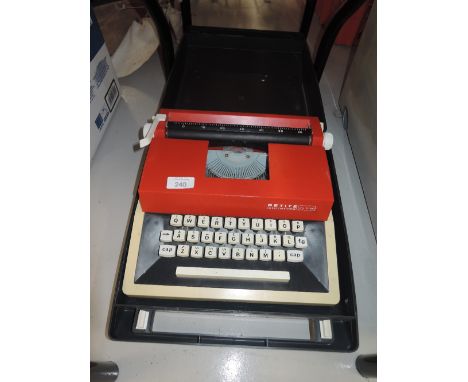A vintage portable typewriter The Petite De Luxe International 