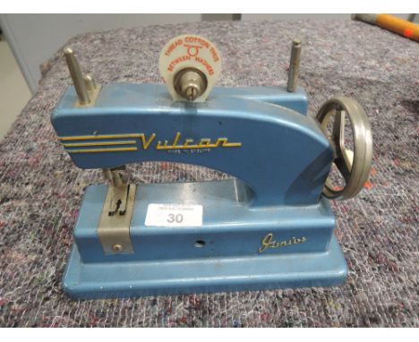 A vintage childs toy sewing machine Vulcan junior 
