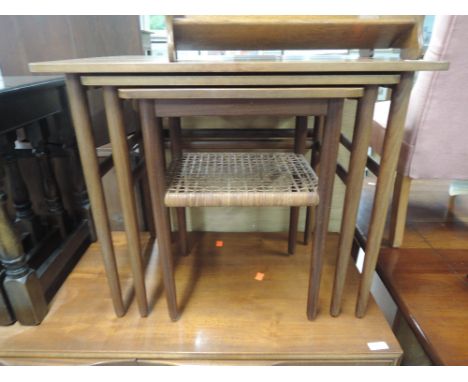 A vintage teak nest of tables