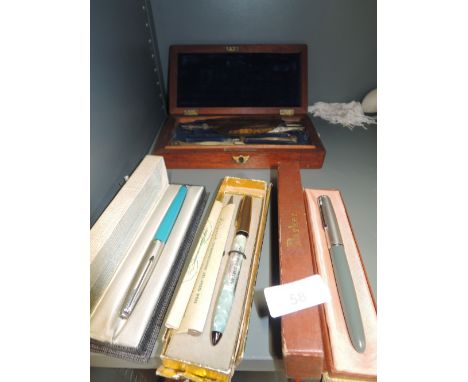 A vintage geometry set and Parker 51 ink pens