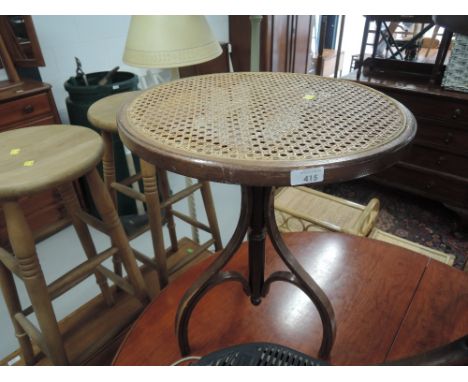 A vintage bentwood and cane occasional table