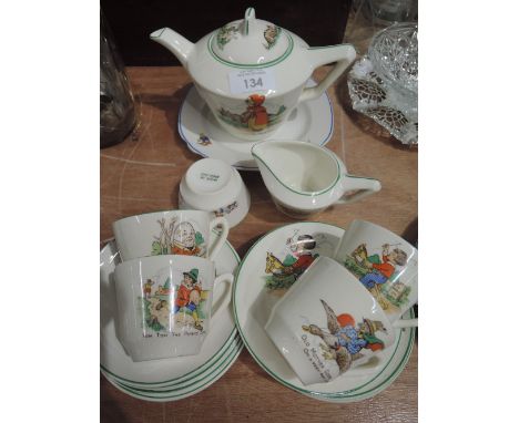 A childs or dolls tea set with nursery rhyme theme print