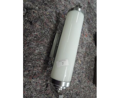 An Art Deco style bed side light with milk glass shade and chrome effect fitment