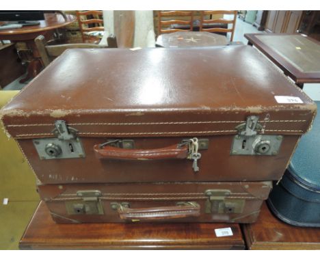 Two vintage leather suitcases