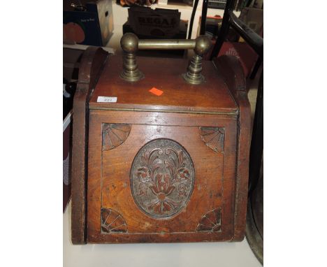 A vintage coal perdonium with carved front panel and tin liner