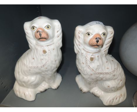 A pair of vintage ceramic Staffordshire style flat back dogs