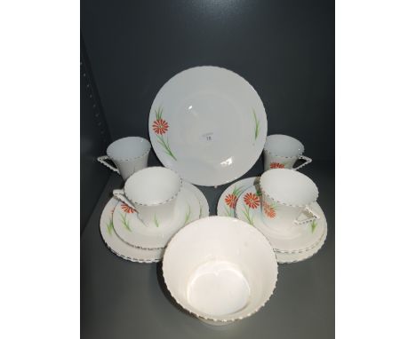 A part tea service by Windsor China hand decorated