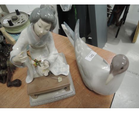 Two vintage ceramic figures by Lladro gull and geisha 