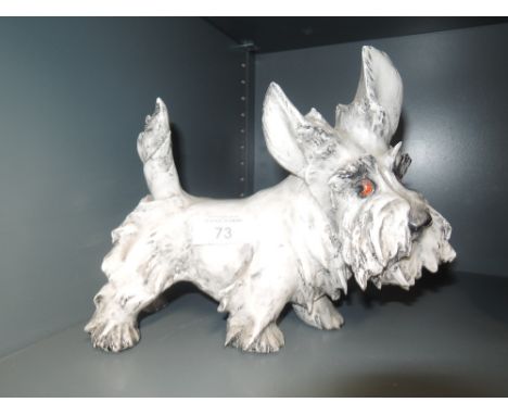 A vintage ceramic dog figure similar to Scottie terrier dog 