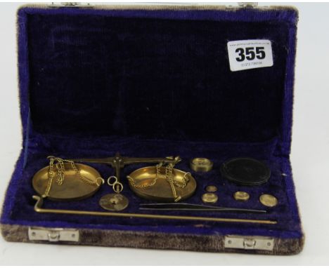 Case set of gold scales and weights