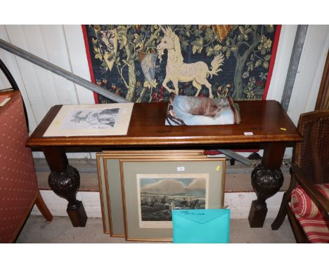 A carved oak console table 