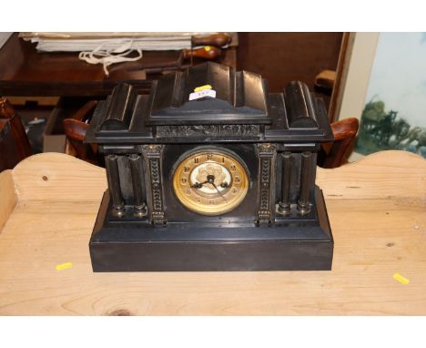 A Victorian marble mantel clock in architectural style case