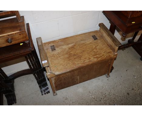 A stripped pine bench with storage compartment