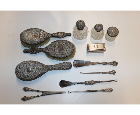 Three silver backed dressing table brushes, various silver mounted dressing table jars and silver handled shoe horn, button h