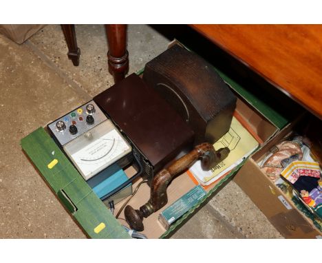 A radio, mantel clock, volt meter, brace drill etc.