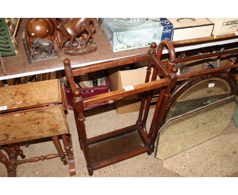 A mahogany stick stand with tray
