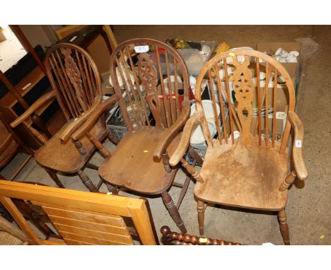 Three elm seated stick and wheel back elbow chairs 
