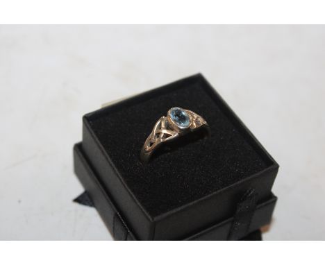 A vintage Sterling silver and blue topaz Celtic knot ring, ring size P/Q