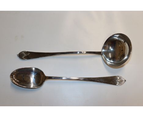 A large plated serving spoon and ladle 