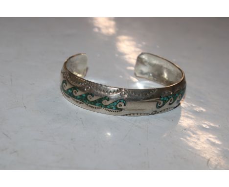 A vintage silver Navajo bangle, signed Naka with turquoise detail, 20gms 