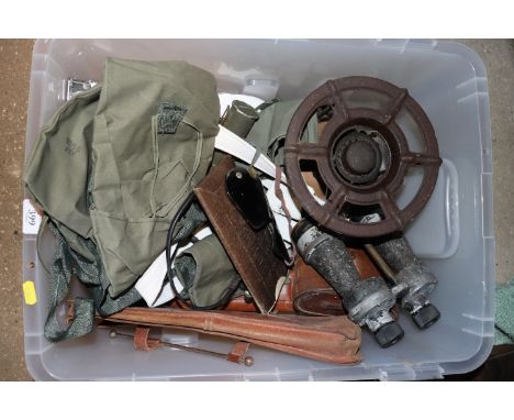 A box of miscellaneous militaria including Mae West, eye shields, binoculars etc.