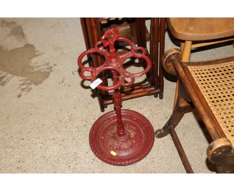 A cast iron snake pattern stick stand
