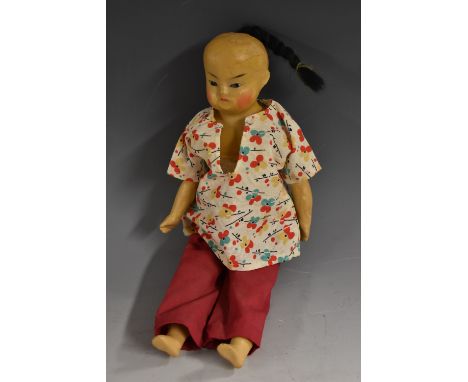 An Asian inspired wax over shoulder doll, moulded paper machete waxed head, inset eyes, rosy cheeks, bald pate with black pla