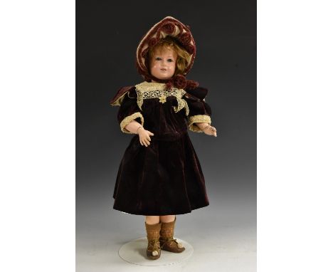 A Societe Francaise de Fabrication de Bebes bisque head character doll, with oopen blue glass eyes, open mouth with four uppe