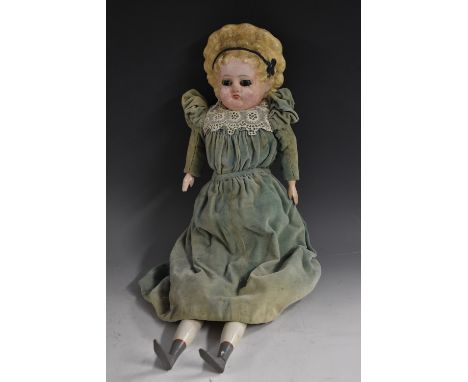 A paper machete waxed over shoulder doll, moulded head, inset glass eyes, painted details,  ribbon painted moulded blond hair