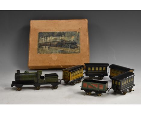 Toys - a miniature tinplate carpet train, six wheel engine, G.N.R green and black livery, Rn 278, two black and two fawn colo