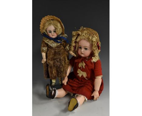 A German bisque head doll,  fixed blue eyes, open mouth two upper teeth, blonde wig, red dress, straw bonnet, 31cm tall, unma