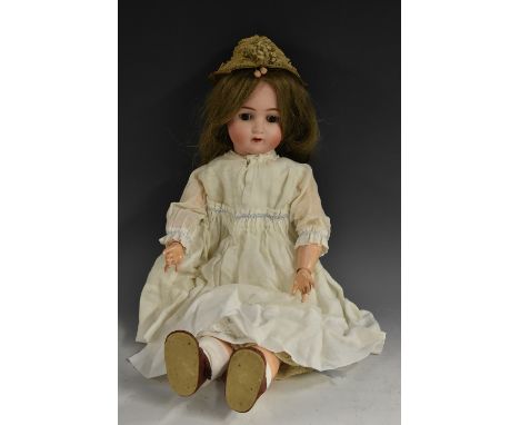 An Alt Beck Gottschalk bisque socket head doll, sleeping brown eyes, open mouth with one tooth, pierced ears, long light brow