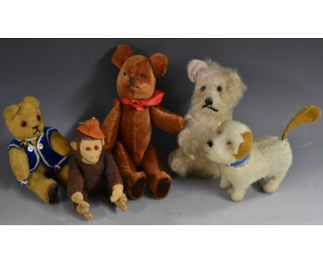 Stuffed Toys - a miniature clockwork figure, terrier dog with spinning tail, 13cm long;  a stuffed felt monkey, with orange h