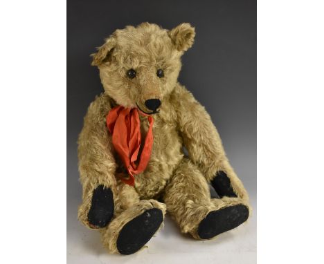 A German mohair jointed teddy bear, with hump, straw filled  button eyes, horizontal stitched nose, small ears, felt pads, fo