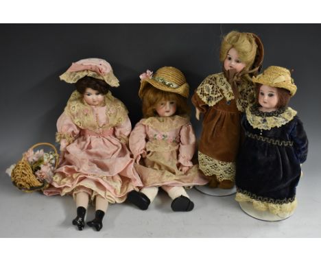 Dolls - an early 20th century style bisque head doll, fixed eyes, open mouth with teeth, long blond hair, stuffed body, mould