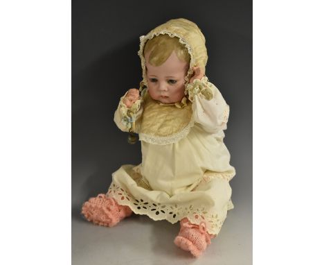 A Kammer &amp; Reinhardt bisque head baby doll, with sleeping blue glass eyes, slightly open mouth, moulded painted hair, joi