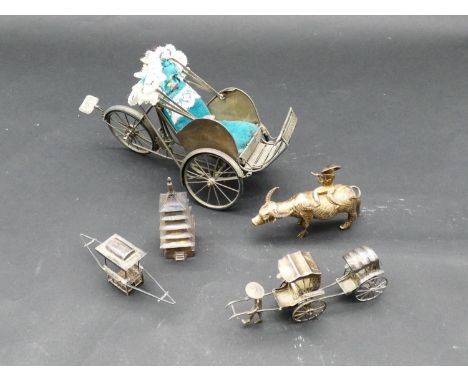 A miscellaneous collection of six Chinese white metal and Chinese silver models. Including carriages, sedan chairs and a man 